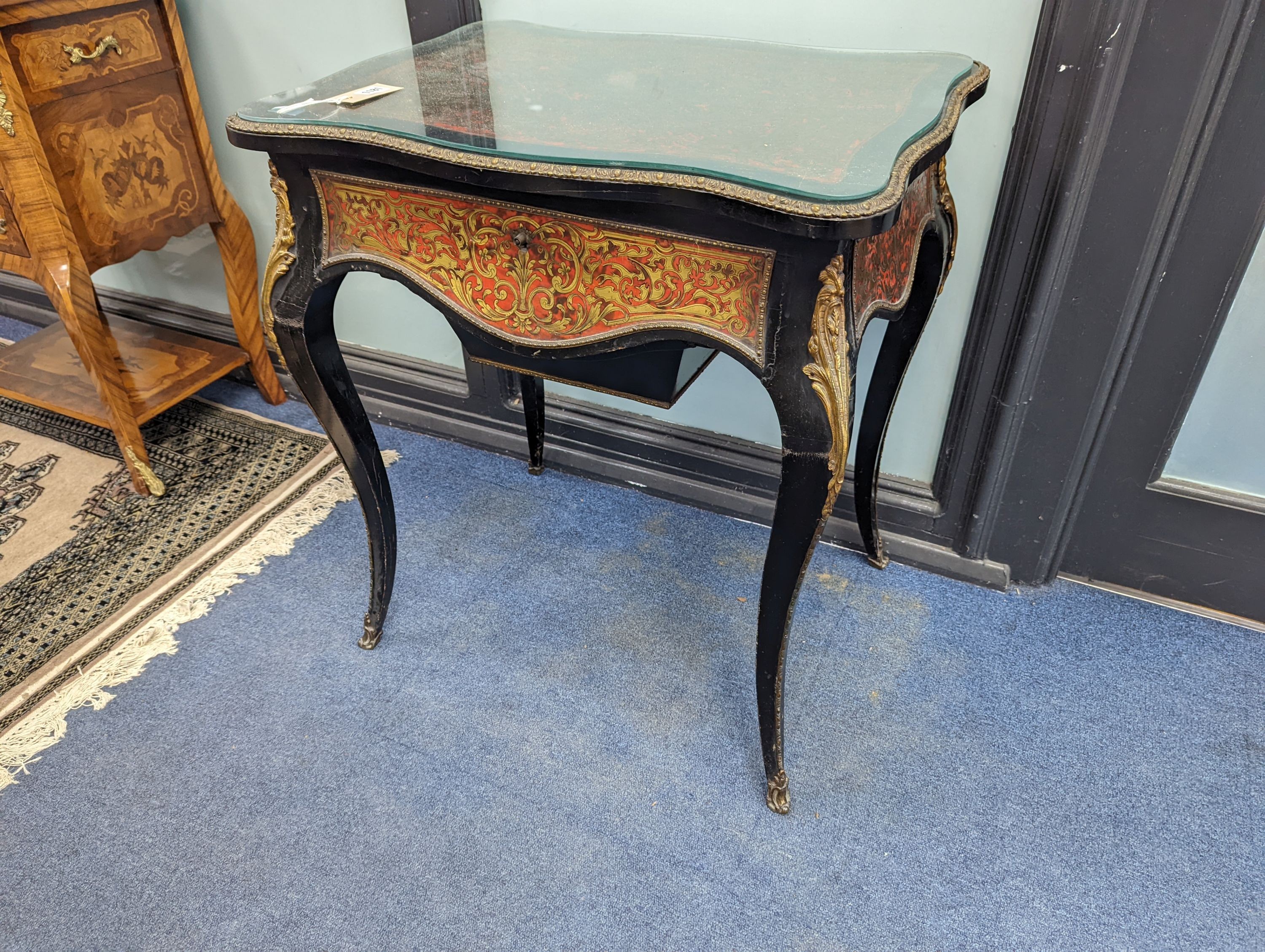 A 19th century French red Boullework poudreuse with mirrored internal lid and fitted interior, width 64cm, height 73cm